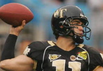 CHARLOTTE, NC - DECEMBER 29:  Riley Skinner #11 of the Wake Forest Demon Deacons throws a pass against the Connecticut Huskies during their game at Bank of America Stadium on December 29, 2007 in Charlotte, North Carolina. (Photo by Streeter Lecka/Getty Images)