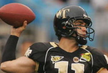 CHARLOTTE, NC - DECEMBER 29:  Riley Skinner #11 of the Wake Forest Demon Deacons throws a pass against the Connecticut Huskies during their game at Bank of America Stadium on December 29, 2007 in Charlotte, North Carolina. (Photo by Streeter Lecka/Getty Images)