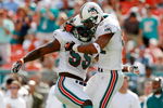 MIAMI - NOVEMBER 11:  Linebacker Joey Porter #55 and defensive end Jason Taylor #99 of the Miami Dolphins celebrate after a tackle for a loss against the Buffalo Bills at Dolphin Stadium on November 11, 2007 in Miami, Florida  (Photo by Doug Benc/Getty Images)