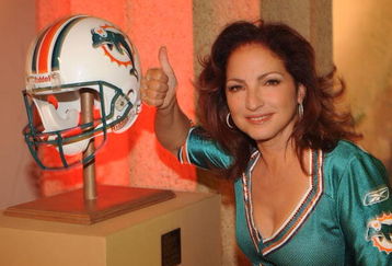 NASHVILLE, TN - JUNE 22:  Gloria Estefan poses with her team The Miami Dolphins helmet before joining Hank Williams Jr. to sing 'Are You Ready for some Football' in Spanish as part of the 40th Anniversary of Monday Night Football at Centennial Park in the Parthenon on June 22, 2009 in Nashville, Tennessee.  (Photo by Rick Diamond/Getty Images)