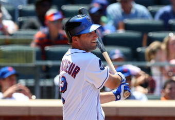NEW YORK - JULY 12:  Jeff Francoeur #12 of the New York Mets bats against the Cincinnati Reds on July 12, 2009 at Citi Field in the Flushing neighborhood of the Queens borough of New York City.  (Photo by Jim McIsaac/Getty Images)