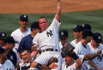 18 Jul 1999: David Cone #36 of the New York Yankees celebrates as his teammates lift him after winning the game against the Montreal Expos at Yankee Stadium in Bronx, New York. The Yankees defeated the Expos 6-0.