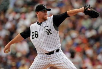 DENVER - JULY 26:  Starting pitcher Aaron Cook #28 of the Colorado Rockies delivers against the San Francisco Giants at Coors Field on July 26, 2009 in Denver, Colorado.  (Photo by Doug Pensinger/Getty Images)