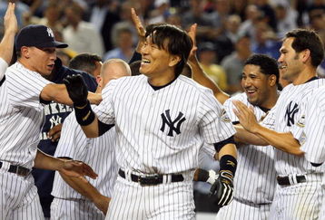 NEW YORK - JULY 20:  Hideki Matsui #55 (R) of the New York Yankees celebrates his game winning ninth inning home run against the Baltimore Orioles with his teammates on July 20, 2009 at Yankee Stadium in the Bronx borough of New York City. The Yankees defeated the Orioles 2-1.  (Photo by Jim McIsaac/Getty Images)