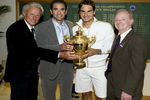 WIMBLEDON, ENGLAND - JULY 05:  Roger Federer of Switzerland (2R) celebrates with the trophy alongside Bjorn Borg (L), Pete Sampras (2L) and Rod Laver (R)  after the men's singles final match against Andy Roddick of USA on Day Thirteen of the Wimbledon Lawn Tennis Championships at the All England Lawn Tennis and Croquet Club on July 5, 2009 in London, England. Federer won 5-7, 7-6, 7-6, 3-6, 16-14, to claim his 15th Grand Slam title.  (Photo by AELTC/Pool/Getty Images)