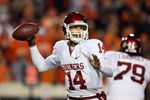 STILLWATER, OK - NOVEMBER 29:  Quarterback Sam Bradford #14 of the Oklahoma Sooners drops back to pass against the Oklahoma State Cowboys at Boone Pickens Stadium on November 29, 2008 in Stillwater, Oklahoma.  (Photo by Ronald Martinez/Getty Images)