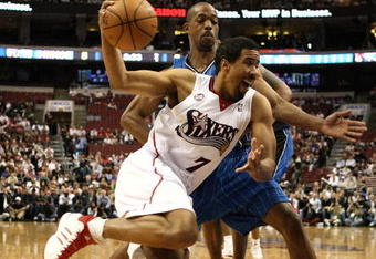 PHILADELPHIA - APRIL 30: Andre Miller #7  of the Philadelphia 76ers drives to the basket against Rafer Alston #1 of the Orlando Magic during Game Six of the Eastern Conference Quarterfinals at Wachovia Center on April 30, 2009 in Philadelphia, Pennsylvania. NOTE TO USER: User expressly acknowledges and agrees that, by downloading and or using this photograph, User is consenting to the terms and conditions of the Getty Images License Agreement.  (Photo by Nick Laham/Getty Images)