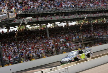 INDIANAPOLIS - JULY 26:  Jimmie Johnson, driver of the #48 Lowe's/KOBALT Tools Chevrolet, crosses the finish line to win the NASCAR Sprint Cup Series Allstate 400 at the Brickyard at Indianapolis Motor Speedway on July 26, 2009 in Indianapolis, Indiana.  (Photo by Ezra Shaw/Getty Images)
