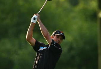 OAKVILLE, ONTARIO - JULY 26:  Mike Weir of Canada plays his second shot on the second hole during round three of the RBC Canadian Open at Glen Abbey Golf Club on July 26, 2009 in Oakville, Ontario, Canada.  (Photo by Chris McGrath/Getty Images)