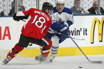 TORONTO - APRIL 11:  Christian Hanson #20 of the Toronto Maple Leafs chases skates around Jesse Winchester #18 of the Ottawa Senators in a game on April 11, 2009 at the Air Canada Centre in Toronto, Ontario. The Leafs defeated the Senators on the strength of a 3 goal performance by Boyd Devereaux #22. (Photo by Claus Andersen/Getty Images)