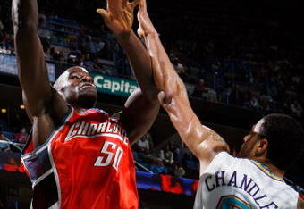 NEW ORLEANS - JANUARY 18:  Emeka Okafor #50 of the Charlotte Bobcats makes a shot over Tyson Chandler #6 of the New Orleans Hornets at the New Orleans Arena January 18, 2008 in New Orleans, Louisiana. The Hornets defeated the Bobcats 112-84. NOTE TO USER: User expressly acknowledges and agrees that, by downloading and/or using this Photograph, user is consenting to the terms and conditions of the Getty Images License Agreement.  (Photo by Chris Graythen/Getty Images)