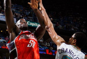 NEW ORLEANS - JANUARY 18:  Emeka Okafor #50 of the Charlotte Bobcats makes a shot over Tyson Chandler #6 of the New Orleans Hornets at the New Orleans Arena January 18, 2008 in New Orleans, Louisiana. The Hornets defeated the Bobcats 112-84. NOTE TO USER: User expressly acknowledges and agrees that, by downloading and/or using this Photograph, user is consenting to the terms and conditions of the Getty Images License Agreement.  (Photo by Chris Graythen/Getty Images)
