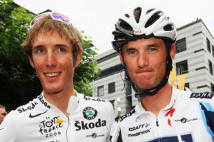 MARTIGNY, SWITZERLAND - JULY 21:  Andy Schleck (l) of Luxembourg and Team Saxo Bank arrives at the start with team mate and brother Frank on stage 16 of the 2009 Tour de France from Martigny to Bourg-Saint-Maurice on July 21, 2009 in Martigny, Switzerland.  (Photo by Bryn Lennon/Getty Images)