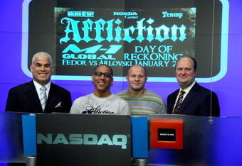 NEW YORK - JANUARY 20:  MMA fighter and former UFC light heavyweight champion Tito Ortiz, VP, Affliction Entertainment Tom Atencio and Fedor Vladimirovich Emelianenko, heavyweight mixed martial artist and current World Alliance of Mixed Martial Arts heavyweight champion rings the NASDAQ opening bell at NASDAQ in Times Square on January 20, 2009 in New York City.  (Photo by Joe Corrigan/Getty Images)