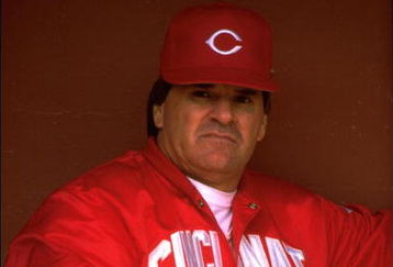 Manager Pete Rose of the Cincinnati Reds looks on from the dugout at Candlestick Park in San Francisco, California.
