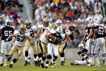 SHREVEPORT, LA - AUGUST 21:  Running back Julius Jones #21 of the Dallas Cowboys is tackled by Rob Ninkovich #93 of the New Orleans Saints during a preseason game on August 21, 2006 at Independence Stadium in Shreveport, Louisiana.  (Photo by Ronald Martinez/Getty Images)