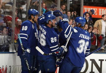TORONTO - JANUARY 31:  Nik Antropov #80, Mike Van Ryn #26 and Anton Stralman #36 of the Toronto Maple Leafs celebrate a goal during the game against the Pittsburgh Penguins at Air Canada Centre on January 31, 2009 in Toronto, Ontario, Canada. (Photo by Dave Sandford/Getty Images)
