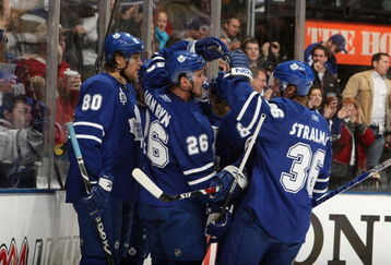 TORONTO - JANUARY 31:  Nik Antropov #80, Mike Van Ryn #26 and Anton Stralman #36 of the Toronto Maple Leafs celebrate a goal during the game against the Pittsburgh Penguins at Air Canada Centre on January 31, 2009 in Toronto, Ontario, Canada. (Photo by Dave Sandford/Getty Images)