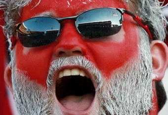 TUSCALOOSA, AL - NOVEMBER 03:  An Alabama fan cheers as the LSU Tigers take on the Alabama Crimson Tide at Bryant-Denny Stadium on November 3, 2007 in Tuscaloosa, Alabama. LSU defeated Alabama 41-34.  (Photo by Doug Benc/Getty Images)