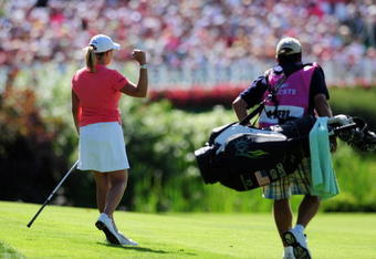 EVIAN-LES-BAINS, FRANCE - JULY 26:  Cristie Kerr of USA celebrates on the 18th hole during the final round of the Evian Masters at the Evian Masters Golf Club on July 26, 2009 in Evian-les-Bains, France.  (Photo by Stuart Franklin/Getty Images)