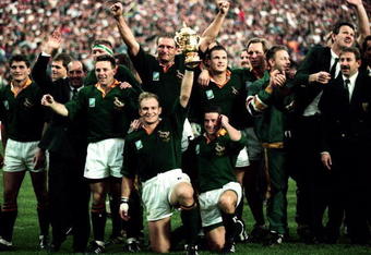 JOHANNESBURG - JUNE 24:  The South African Team celebrate after winning the Rugby World Cup final between South Africa and New Zealand held on June 24, 1995 at Ellis Park in Johannesburg, South Africa.  South Africa won the match 15-12.  (Photo by Getty Images) 