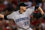 ANAHEIM, CA - MAY 6:  Roy Halladay #32 of the Toronto Blue Jays throws a pitch against the Los Angeles Angels of Anaheim at Angel Stadium May 6, 2009 in Anaheim, California.  (Photo by Stephen Dunn/Getty Images)