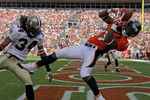 DENVER - SEPTEMBER 21:  Wide receiver Eddie Royal #19 of the Denver Broncos is unable to stay inbounds as he makes a reception in the endzone as corner back Mike McKenzie #34 of the New Orleans Saints defends during NFL action at Invesco Field at Mile High on September 21, 2008 in Denver, Colorado. The Broncos defeated the Saints 34-32.  (Photo by Doug Pensinger/Getty Images)