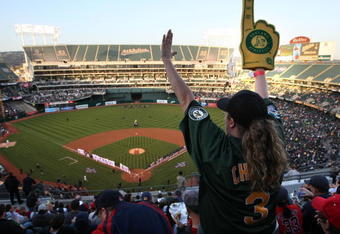 OAKLAND, CA - APRIL 01:  An Oakland A's fan cheers before the start of the Opening Day game of the Oakland Athletics and The Boston Red Sox at the McAfee Coliseum April 1, 2008 in Oakland, California.  (Photo by Justin Sullivan/Getty Images)