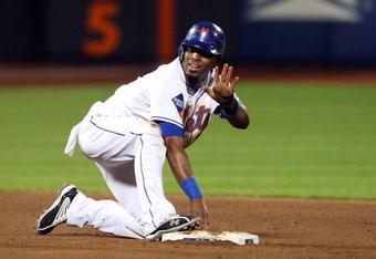 NEW YORK - MAY 12:  Jose Reyes #7 of the New York Mets is safe at second base against the Atlanta Braves on May 12, 2009 at Citi Field in the Flushing neighborhood of the Queens borough of New York City. The Mets defeated the Braves 4-3 in ten innings.  (Photo by Jim McIsaac/Getty Images)