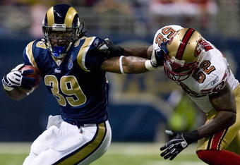 ST. LOUIS, MO - DECEMBER 21: Steven Jackson #39 of the St. Louis Rams looks to get past Patrick Willis #52 of the San Francisco 49ers at the Edward Jones Dome on December 21, 2008 in St. Louis, Missouri.  (Photo by Dilip Vishwanat/Getty Images)