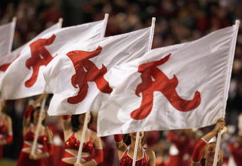 TUSCALOOSA, AL - NOVEMBER 15: The flag girls of the Alabama Crimson Tide marching band perform before the game against the Mississippi State Bulldogs at Bryant-Denny Stadium on November 15, 2008 in Tuscaloosa, Alabama. (Photo by Kevin C. Cox/Getty Images)