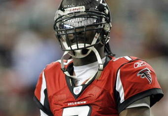 ATLANTA - DECEMBER 24: Quarterback Michael Vick #7 of the Atlanta Falcons looks on during the game against the Carolina Panthers on December 24, 2006 at The Georgia Dome in Atlanta,Georgia. (Photo by Marc Serota/Getty Images)