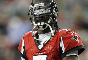 ATLANTA - DECEMBER 24: Quarterback Michael Vick #7 of the Atlanta Falcons looks on during the game against the Carolina Panthers on December 24, 2006 at The Georgia Dome in Atlanta,Georgia. (Photo by Marc Serota/Getty Images)