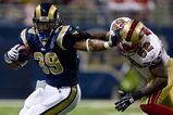 ST. LOUIS, MO - DECEMBER 21: Steven Jackson #39 of the St. Louis Rams looks to get past Patrick Willis #52 of the San Francisco 49ers at the Edward Jones Dome on December 21, 2008 in St. Louis, Missouri.  (Photo by Dilip Vishwanat/Getty Images)