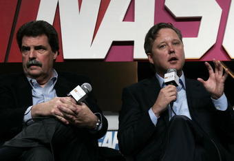CONCORD, NC - JANUARY 22:  NASCAR President Mike Helton (L) and CEO/Chairman Brian France speak with the media during the NASCAR Sprint Media Tour hosted by Lowe's Motor Speedway at the NASCAR Research and Development Center January 22, 2009 in Concord, North Carolina.  (Photo by Jason Smith/Getty Images for NASCAR )