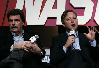 CONCORD, NC - JANUARY 22:  NASCAR President Mike Helton (L) and CEO/Chairman Brian France speak with the media during the NASCAR Sprint Media Tour hosted by Lowe's Motor Speedway at the NASCAR Research and Development Center January 22, 2009 in Concord, North Carolina.  (Photo by Jason Smith/Getty Images for NASCAR )