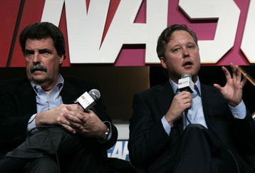 CONCORD, NC - JANUARY 22:  NASCAR President Mike Helton (L) and CEO/Chairman Brian France speak with the media during the NASCAR Sprint Media Tour hosted by Lowe's Motor Speedway at the NASCAR Research and Development Center January 22, 2009 in Concord, North Carolina.  (Photo by Jason Smith/Getty Images for NASCAR )