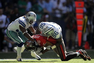 IRVING, TX - OCTOBER 26:  Tight end Jerramy Stevens #86 of the Tampa Bay Buccaneers is tackled by Bradie James #56 and Mike Jenkins #31 of the Dallas Cowboys at Texas Stadium on October 26, 2008 in Irving, Texas.  (Photo by Ronald Martinez/Getty Images)