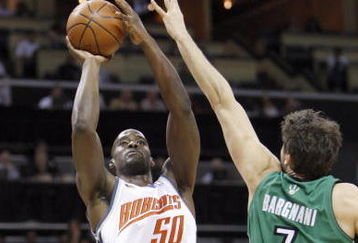 CHARLOTTE, NC - MARCH 16:  Emeka Okafor #50 of the Charlotte Bobcats takes a shot against Andrea Bargnani #7 of the Toronto Raptors during their game at Time Warner Cable Arena on March 16, 2009 in Charlotte, North Carolina.  NOTE TO USER: User expressly acknowledges and agrees that, by downloading and/or using this Photograph, user is consenting to the terms and conditions of the Getty Images License Agreement. (Photo by: Streeter Lecka/Getty Images)