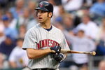 KANSAS CITY, MO - MAY 28:  Joe Mauer #7 of the Minnesota Twins walks off the field with his bat against the Kansas City Royals on May 28, 2008 at Kauffman Stadium in Kansas City, Missouri. (Photo by G. Newman Lowrance/Getty Images)