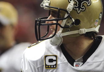 ATLANTA - NOVEMBER 9: Quarterback Drew Brees #9 of the New Orleans Saints cheers a play against the Atlanta Falcons at the Georgia Dome on November 9, 2008 in Atlanta, Georgia.  (Photo by Al Messerschmidt/Getty Images) 