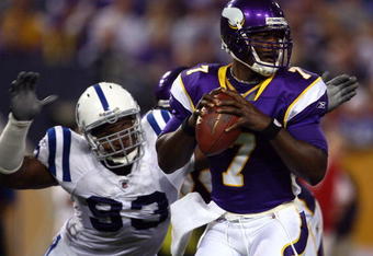 MINNEAPOLIS - SEPTEMBER 14:  Quarterback Tavaris Jackson #7 of the Minnesota Vikings drops back to pass before being sacked by Dwight Freeney #93 of the Indianapolis Colts in the third quarter at the Metrodome on September 14, 2008 in Minneapolis, Minnesota. The Colts defeated the Vikings 18-15.  (Photo by Jeff Gross/Getty Images)