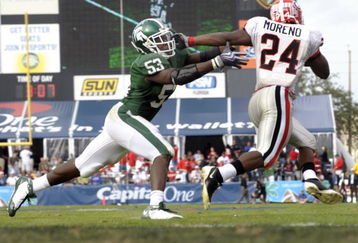 ORLANDO, FL - JANUARY 1: Running back Knowshon Moreno #24 of the University of Georgia rushes around linebacker Greg Jones #53 of the Michigan State Spartans at the 2009 Capital One Bowl at the Citrus Bowl on January 1, 2009 in Orlando, Florida.  (Photo by Al Messerschmidt/Getty Images) 