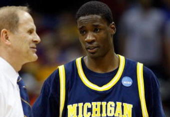 KANSAS CITY, MO - MARCH 19:  Head Coach John Beilein and Manny Harris #3 of the Michigan Wolverines look on after their first round game against the Clemson Tigers in the NCAA Division I Men's Basketball Tournament at the Sprint Center on March 19, 2009 in Kansas City, Missouri.  The Wolverines defeated the Tigers 62-59.  (Photo by Jamie Squire/Getty Images)