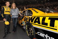 CONCORD, NC - MAY 16: Matt Kenseth, driver of the #17 DEWALT Ford, and his wife Katie observe the National Anthem during the NASCAR Sprint All-Star Race on May 16, 2009 at Lowe's Motor Speedway in Concord, North Carolina.  (Photo by Drew Hallowell/Getty Images for NASCAR)