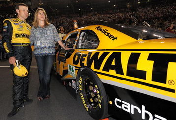CONCORD, NC - MAY 16: Matt Kenseth, driver of the #17 DEWALT Ford, and his wife Katie observe the National Anthem during the NASCAR Sprint All-Star Race on May 16, 2009 at Lowe's Motor Speedway in Concord, North Carolina.  (Photo by Drew Hallowell/Getty Images for NASCAR)
