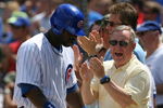 CHICAGO - JULY 26: Senator Richard Durbin (D-IL) joins Chicago Cub fans in cheering Milton Bradley #21 after Bradley scored a run on a play at the plate in the 3rd inning against the Cincinnati Reds on July 26, 2009 at Wrigley Field in Chicago, Illinois. (Photo by Jonathan Daniel/Getty Images)