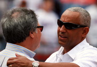MIAMI - MARCH 31:  Owner Jeffrey H. Loria (L) of the Florida Marlins greets general manager Omar Minaya of the New York Mets on Opening Day at Dolphin Stadium on March 31, 2008 in Miami, Florida.  (Photo by Doug Benc/Getty Images)