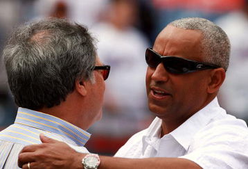 MIAMI - MARCH 31:  Owner Jeffrey H. Loria (L) of the Florida Marlins greets general manager Omar Minaya of the New York Mets on Opening Day at Dolphin Stadium on March 31, 2008 in Miami, Florida.  (Photo by Doug Benc/Getty Images)