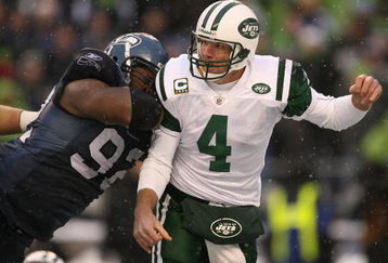 SEATTLE - DECEMBER 21:  Quarterback Brett Favre #4 of the New York Jets is hit after passing by Brandon Mebane #92 of the Seattle Seahawks on December 21, 2008 at Qwest Field in Seattle, Washington. The Seahawks defeated the Jets 13-3.(Photo by Otto Greule Jr/Getty Images)